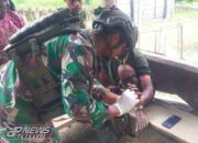 Satgas Yonif 323 Buaya Putih Obati Warga yang Terluka Robek di Tangan