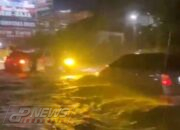 Jalan Cibeber Banjir Setinggi Satu Paha Dikarenakan Buruknya Sistem Saluran Air